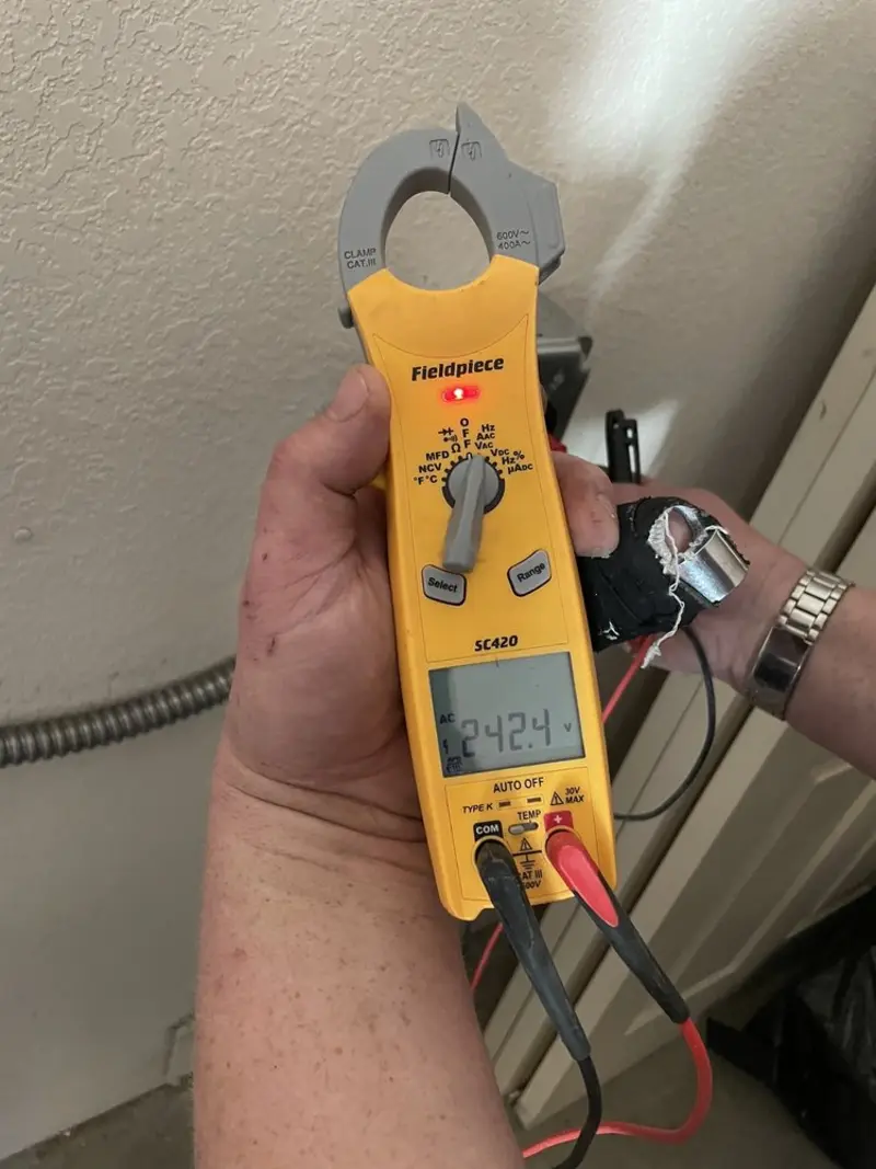 Voltage testing with clamp meter during Outlet Installation in New Haven